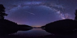 Long time exposure night landscape with Milky Way Galaxy during the Perseids flow above the Beglik dam in Rhodopi Mountains, Bulgaria