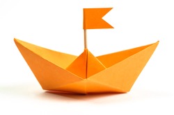 Orange origami paper boat isolated on white