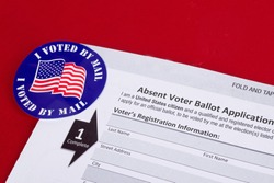 Absent voter ballot application. I voted by mail ￼sticker. Absentee forms.￼