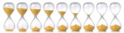 Collection of hourglasses with yellow sand showing the passage of time