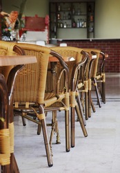 Empty cafe interior with wooden tables and chairs
