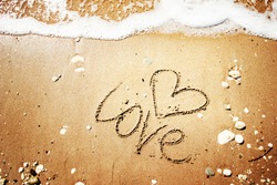 love message written in sand