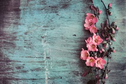 Beautiful flower on grunge wooden table