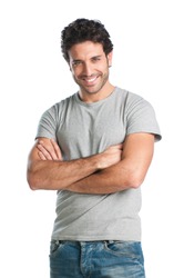 Casual young man looking at camera with arms crossed and satisfaction
