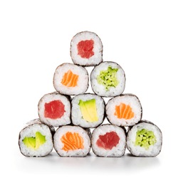 Fresh hosomaki in a pyramid isolated on white background. Sushi roll with salmon, tuna, avocado and cucumber. Traditional japanese food with maki. Delicious sushi pieces.
