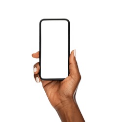 Close up of mature african hand holding smartphone with blank screen isolated on while background. Black woman showing empty screen of modern cellphone. Mature hand showing white screen of smart phone