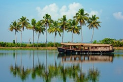 Travel tourism Kerala background - houseboat on Alleppey backwaters. Kerala houseboat image