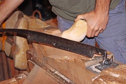 The making of clogs, a traditional Dutch craft of making wooden traditional shoes.