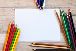 School supplies on wooden background - space for caption
