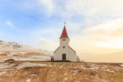 Lonely countryside church on hill in winter at Vik (Vik i Myrdal) Iceland.