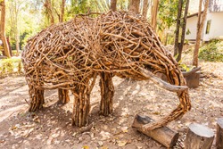 an elefant sculpture made of twigs wooden sticks