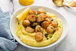 Seared scallops with grits and lemon butter sauce