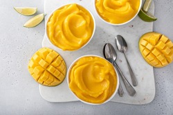 Mango ice cream or nice cream or smoothie, blended frozen mango dessert with lime juice