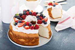 Angel food cake with whipped cream and fresh berries