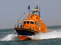 Close up of lifeboat sailing on ocean.