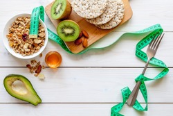 Concept diet - healthy food with muesli, honey, kiwi and cereals
