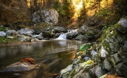 Devil's Path - picturesque eco-path and hiking trail in the Rhodopes mountains, Bulgaria. Small waterfall at autumn 