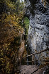 Devil's Path - picturesque eco-path and hiking trail in the Rhodopes mountains, Bulgaria. Wooden  bridge under the rock formation Devils bridge