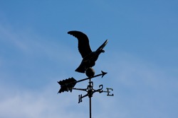 Eagle weather vane in a beautiful blue sky