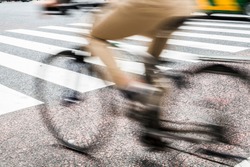 Motion blurry image man riding bicycle on the road