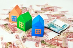 Three colored house on a background of Russian money