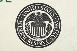 Close up on US dollar banknotes. U.S. Treasury Seal on US Dollar banknotes. Shooting by 1:1 Macro lense.