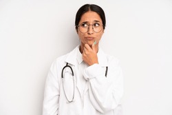 hispanic pretty woman thinking, feeling doubtful and confused. physician student concept