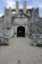 Triangular pediment-barrel vaulted main entrance to the Spanish founded-triangular shaped-coral stone built Fuerte-Fort-Fuerza de San Pedro with today's structure dated 1738 AD. Cebu city-Philippines.