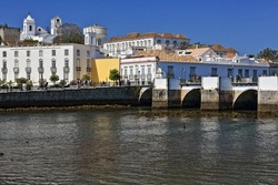 The so-called Ponte Romana-Roman Bridge dating from the 12th century-reconstructed in the 17th century spans the Gilao river linking the two parts of the town. Tavira city-Algarve province-Portugal.