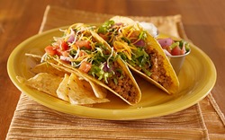 Tacos on a platter with tortillas - mexican food