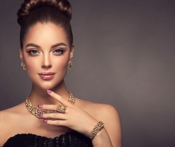 Beautiful girl with jewelry . A set of jewelry for woman ,necklace ,earrings and bracelet. Beauty and accessories.