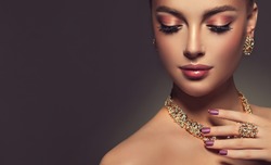 Beautiful girl with jewelry . A set of jewelry for woman ,necklace ,earrings and bracelet. Beauty and accessories.