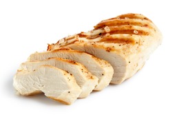  Partially sliced grilled chicken breast with black pepper and rock salt isolated on white.