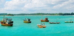 Fishing boats in  sea lagoon. Sri Lanka. Wide photo.