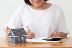 Woman preparing documents file for loan home and refinance