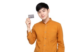 Young Asian man holding credit card isolated on white background