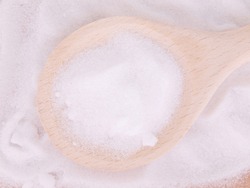 MSM pure powder in wooden spoon
