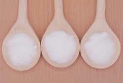 MSM pure powder in 3 wooden spoons.