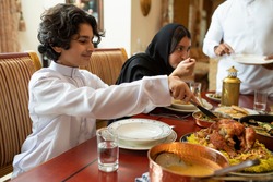 Arabian family having dinner, Arabian family eating iftar in Ramadan 