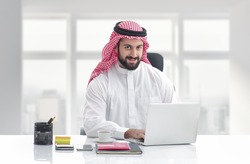 Arabian business man working on Laptop in the office