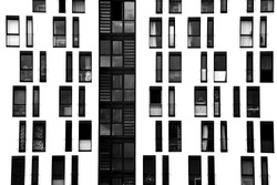 The photograph of a facade with symmetrically arranged windows/window facade