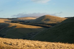 The summit of Ward Law on a sunny winters morning in the Northumberland Cheviot mountains at sunrise, UK.