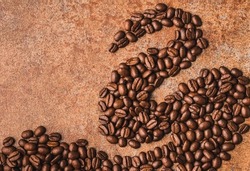 Coffee beans art draw copy space background.Creative concept photo stream made of roasted coffee beans.