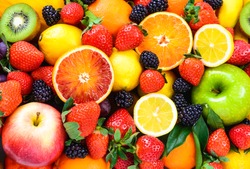 Fresh fruits background. Juicy fruits.