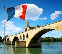 Pont Saint-Benezet with French flag in Avignon, France