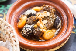 Moroccan lamb tajine with prunes, apricots, almonds and sesame seeds