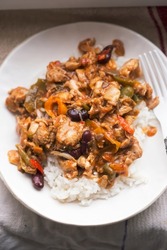 Chicken shawarma with vegetables in spicy sauce and rice 