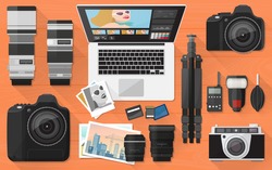 Professional photographer equipment on a desk, shooting and photo editing concept, flat lay