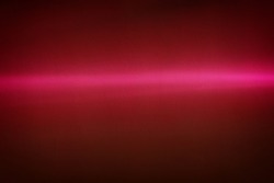 Rays of light on a painted wall background. Blurred abstract background light effect, light leaks. Side surface illumination. Parallel and asymmetric lines or stripes of light at an angle