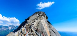 Hike on Moro Rock Staircase toward mountain top, granite dome rock formation in Sequoia National Park, Sierra Nevada mountains, California, USA
